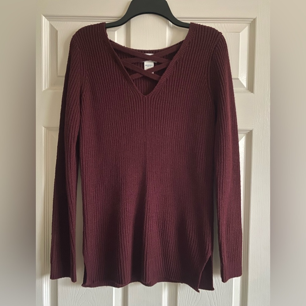 Maroon sweater with crisscross neck line